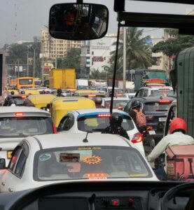 Captured urban traffic congestion in Bengaluru, India, showcasing busy streets filled with vehicles.